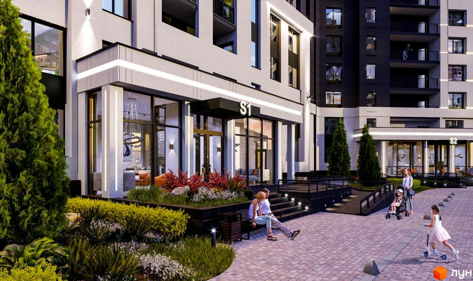 Зовнішній вигляд будинку POLARIS Home&Plaza з великими вікнами та освітленням. На передньому плані озеленена прибудинкова територія.