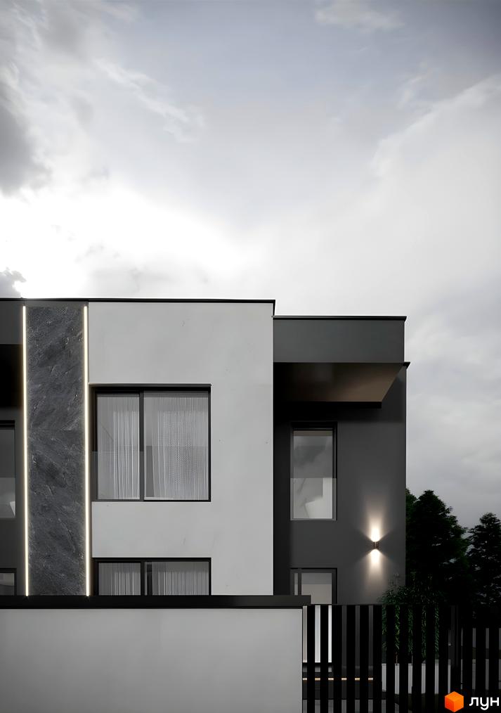 Фасад Дуплексів Loft House у білих та темно-сірих тонах з великими вікнами та декоративним підсвічуванням. На передньому плані видно чорний паркан та дерева.