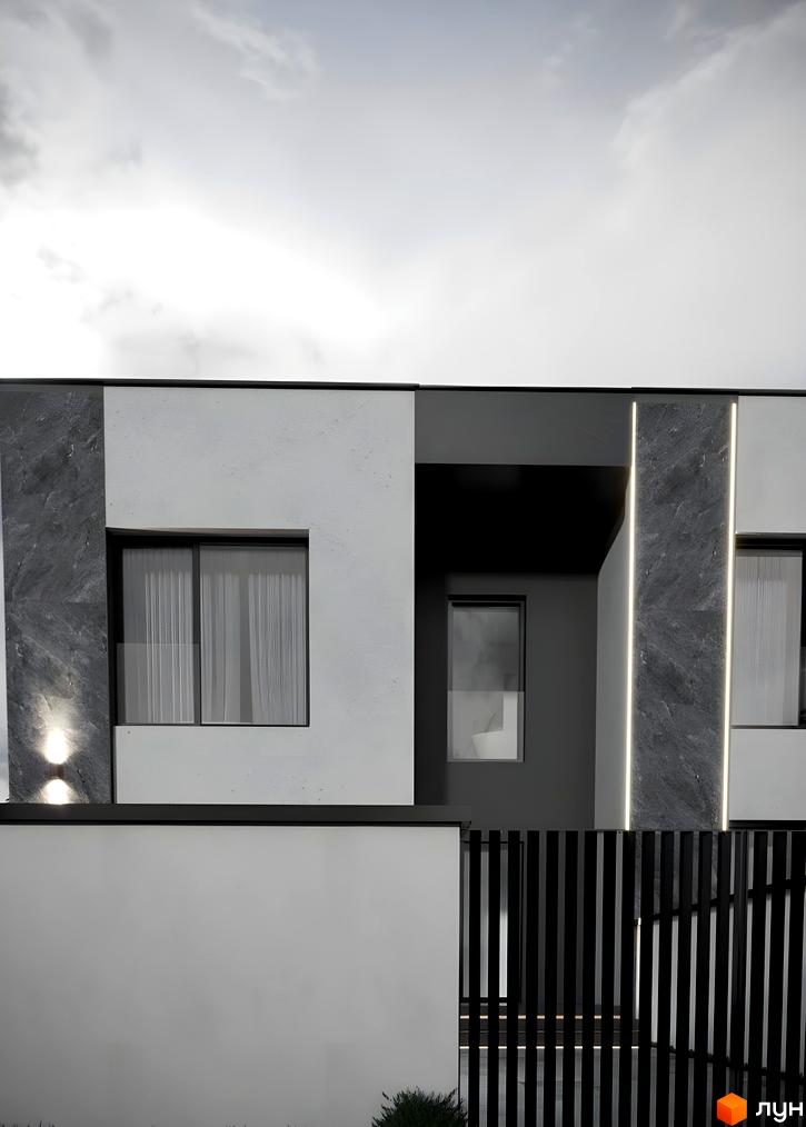 Фасад дуплексу Loft House з контрастними білими та темними елементами, вертикальною підсвіткою та вікнами. Перед будинком розташована огорожа та зелені насадження.
