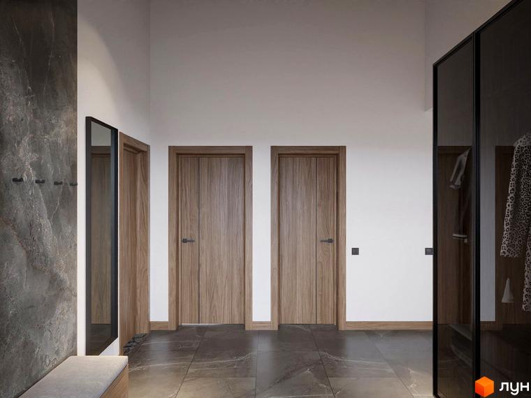 Інтер'єр передпокою в Apartel Shayan Villas з дерев'яними дверима, темною підлогою та дзеркалом. Простір доповнений шафою та місцем для сидіння.