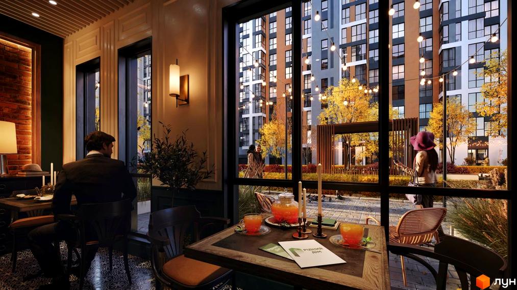 Житловий комплекс Рідний Дім з фасадами різних кольорів та прибудинковою територією з осінніми деревами та освітленням.