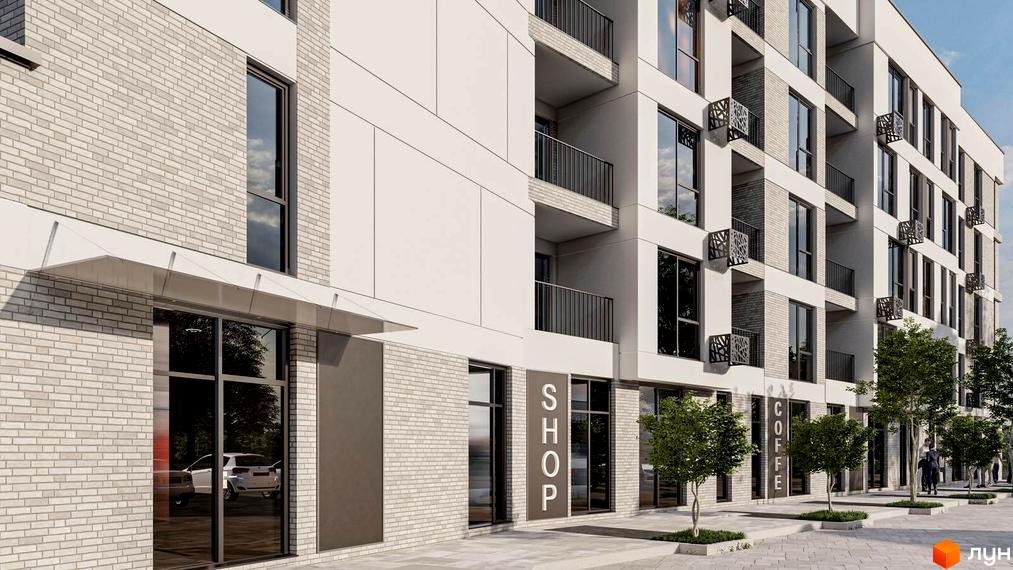 Фасад будівлі житлового комплексу San Marco з великими вікнами та балконами. На першому поверсі розташовані магазини та кав'ярні, перед будинком висаджені дерева.