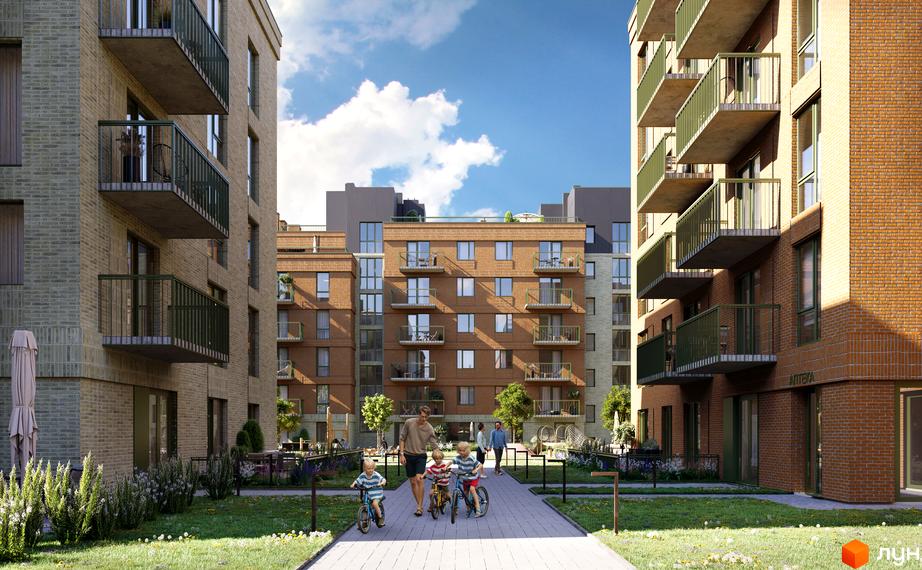 Зовнішній вигляд житлового комплексу WAWEL з цегляними фасадами та балконами, що виходить на зелену прибудинкову територію з дитячою зоною.