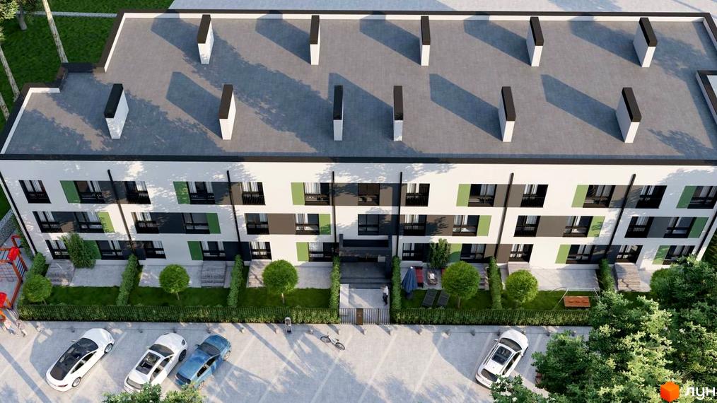 Вид на будівлю Клубний будинок „ЛАГОМ +“ з висоти пташиного польоту. На передньому плані парковка, зелені насадження, дитячий майданчик.