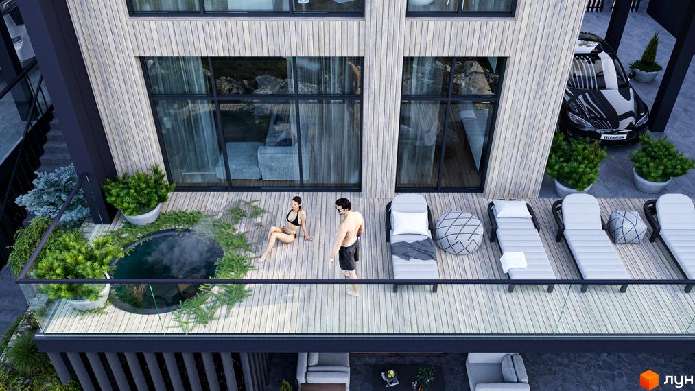 Вид на котеджний комплекс KM Enhance Bukovel з терасою, басейном та зоною відпочинку. Сучасний дизайн фасаду з великими вікнами та дерев'яним оздобленням.