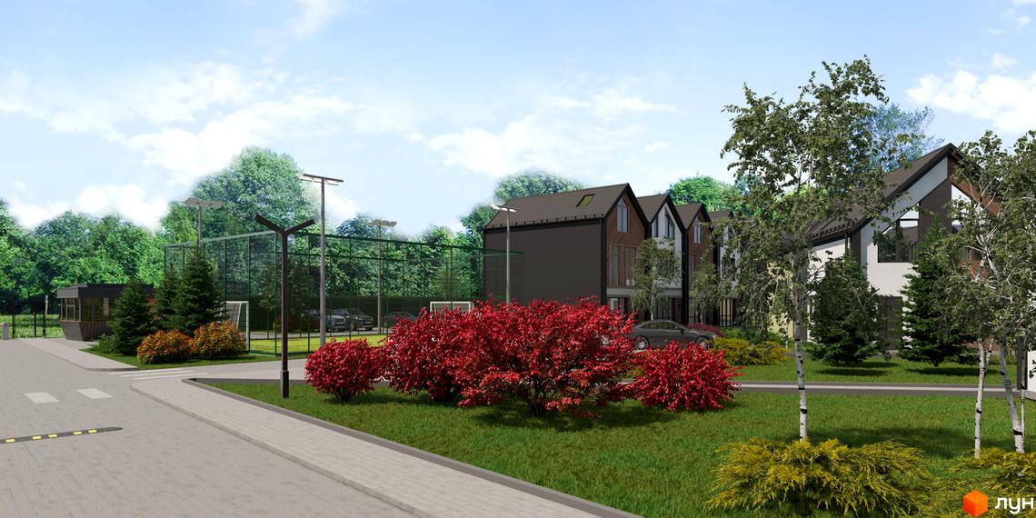 Зображення житлового комплексу. На фото видно будинки з темними дахами та світлими фасадами, а також доглянуту територію з деревами та газонами.