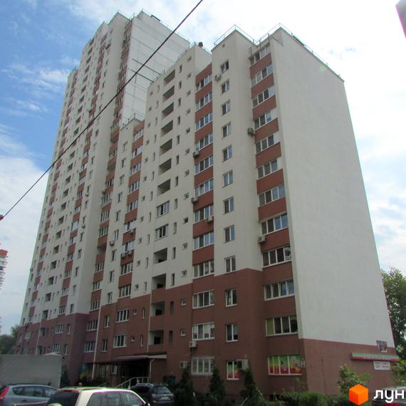 Житловий комплекс просп. Червоної Калини, 1-3. Високий будинок з балконами та прибудинковою територією.