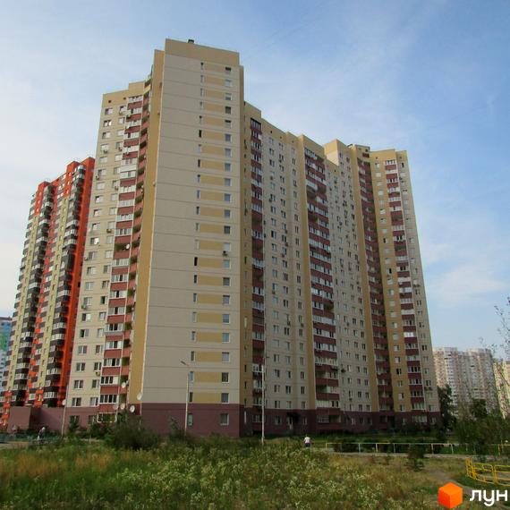 Житловий комплекс просп. Григоренко, 12-14, з висотними будинками та прибудинковою територією з зеленими насадженнями.