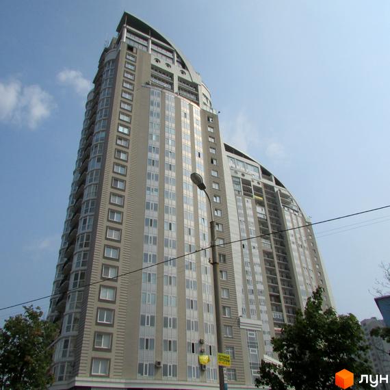 Житловий комплекс просп. Володимира Івасюка, 2, висотна будівля з великими вікнами та балконами. Прибудинкова територія з зеленими насадженнями.