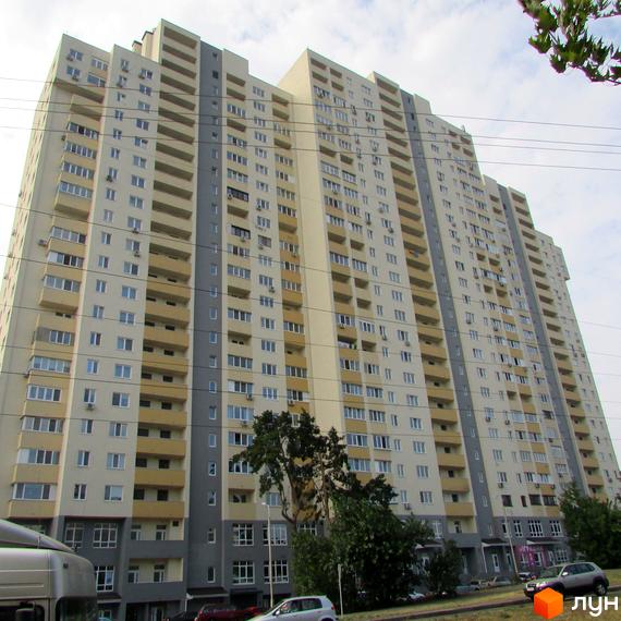 Житловий комплекс Перовський з багатоповерховими будинками та прибудинковою територією з зеленими насадженнями.