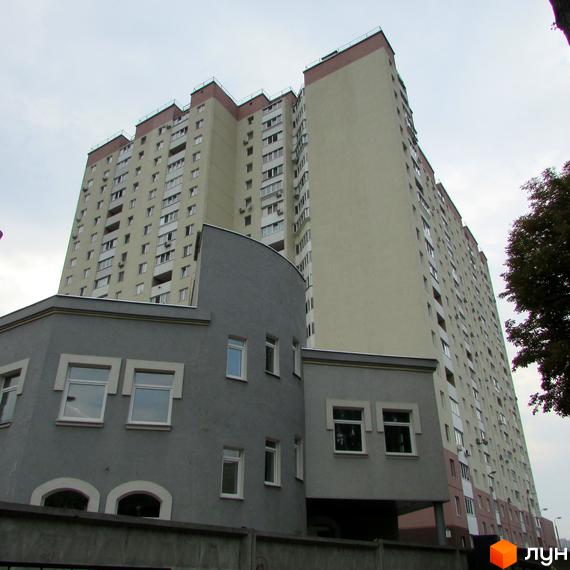 Житловий комплекс на Белицькій, 20. Багатоповерховий будинок з сірою прибудовою. Зовнішній вигляд новобудови.