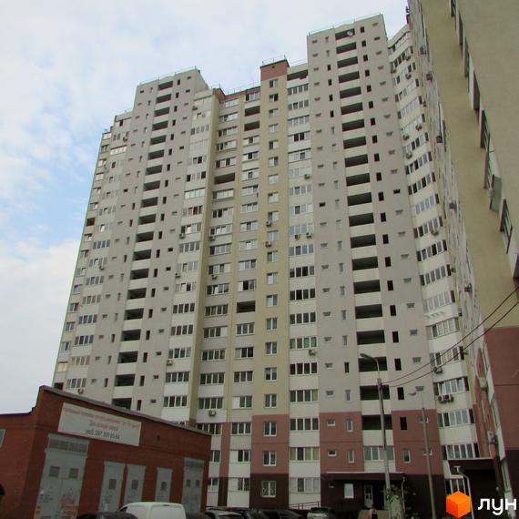 Житловий комплекс на вул. Белицька, 20, з високими багатоповерховими будинками та прибудинковою територією.