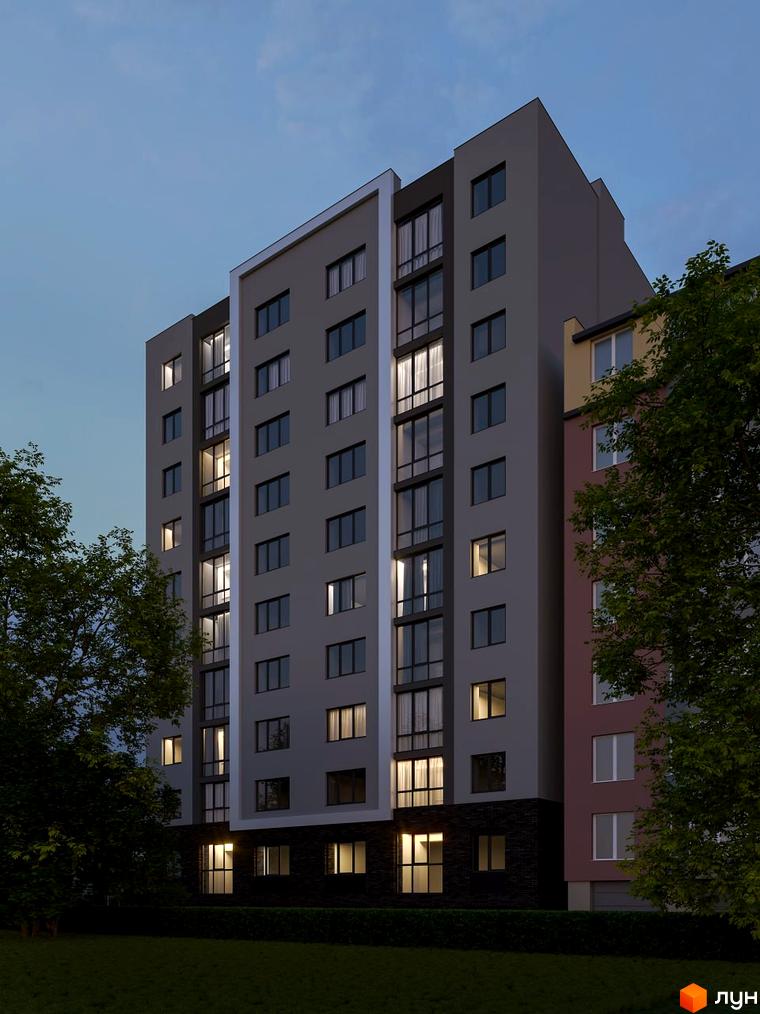 Сучасний житловий комплекс Комфорт Сіті з сірими фасадами та великими вікнами, оточений деревами та зеленою галявиною.