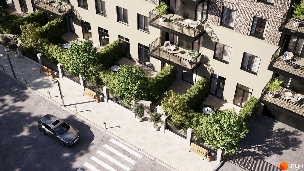 Житловий комплекс LOFT EGOIST зі світлим фасадом, темними вікнами та балконами. Прибубудинкова територія має зелені зони та пішохідні доріжки.