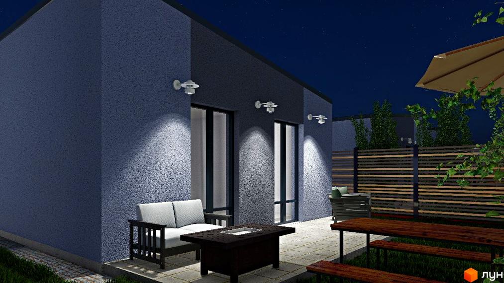 Зовнішній вигляд будинку в КМ Smart Forest з темним фасадом, освітленням та зоною відпочинку на терасі з меблями.
