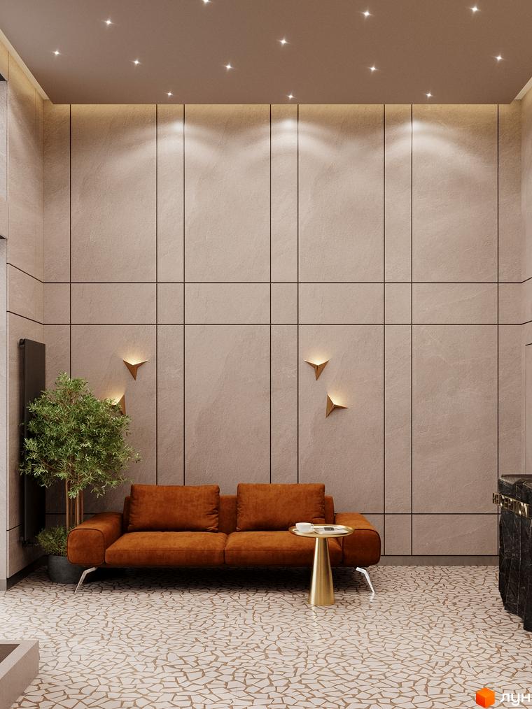 Затишна зона відпочинку в ЖК River Port: диван, столик, рослини та декоративне освітлення на тлі оздобленої стіни.