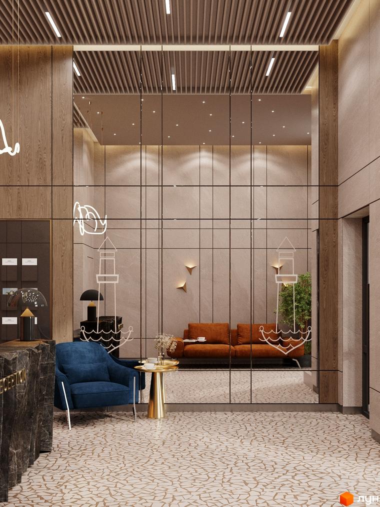 Інтер'єр холу в ЖК River Port з м'якими меблями, декоративними елементами та великим дзеркалом, що візуально збільшує простір.