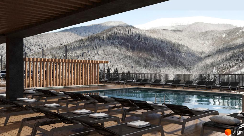 Територія Комплексу „Меланіт Резорт & СПА“ з відкритим басейном та лежаками. Вид на засніжені гори та ліс.