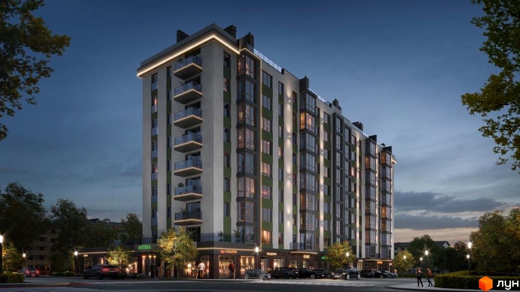 Житловий комплекс Паркова Долина ввечері. Багатоповерховий будинок зі світлим та зеленим фасадом, балконами та комерційними приміщеннями на першому поверсі, освітлена вулиця.