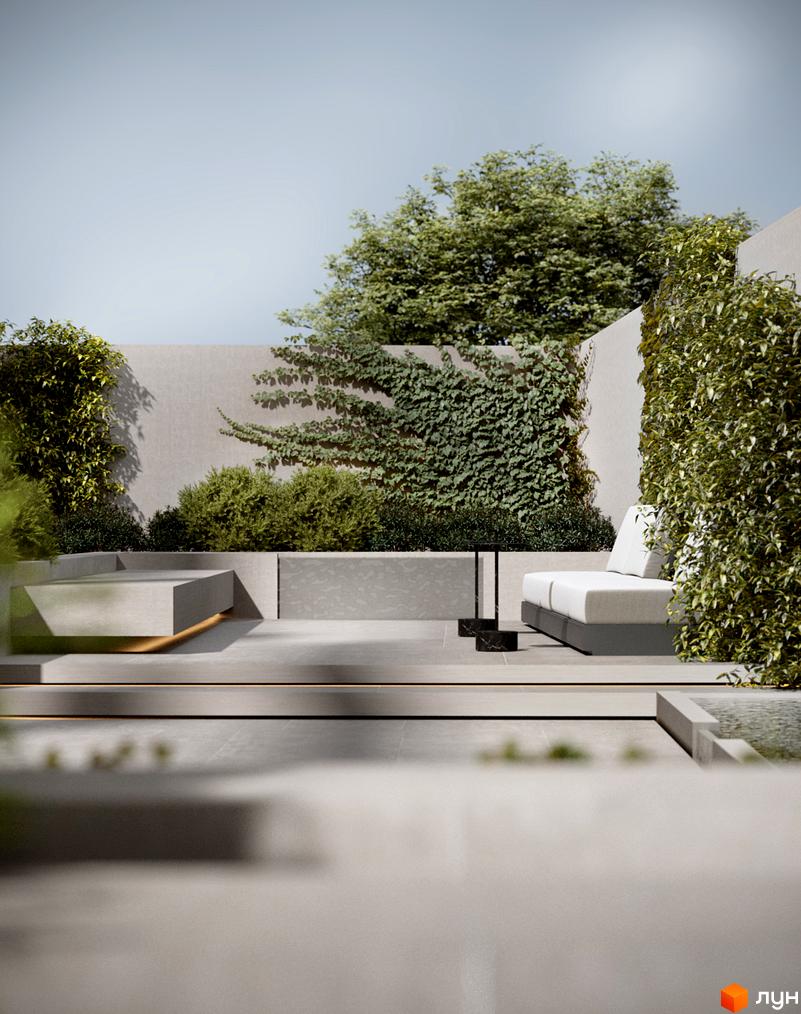 Зображення тераси з лаунж зоною на території Житлового комплексу PANORAMA. Навколо багато зелені, кущі та дерева.