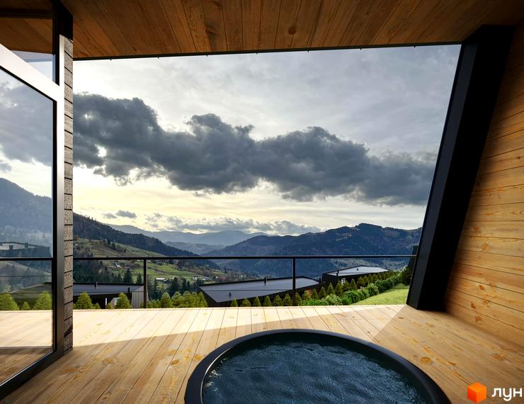 Вид з тераси Котеджного містечка Emshir Villas на гори та басейн. Дерев'яне оздоблення будинку та панорамні вікна з краєвидом.
