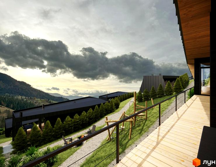 Котеджне містечко Emshir Villas: чорні будинки з пласкими дахами на гірському схилі. Територія має гравійні доріжки, хвойні дерева та дитячий майданчик.