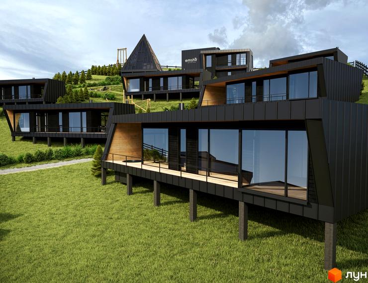 Зображення Котеджного містечка Emshir Villas: будинки з великими вікнами та дерев'яними терасами на зеленій галявині.