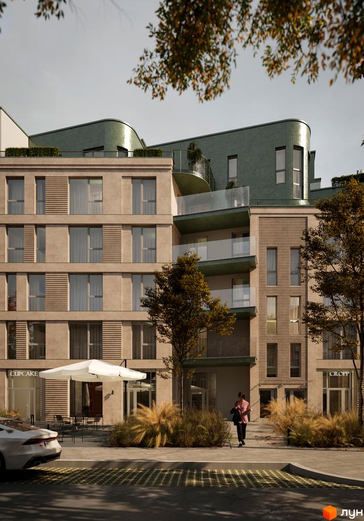 Зображення фасаду будинку Житлового комплексу D2 з магазинами на першому поверсі та облаштованою прибудинковою територією.