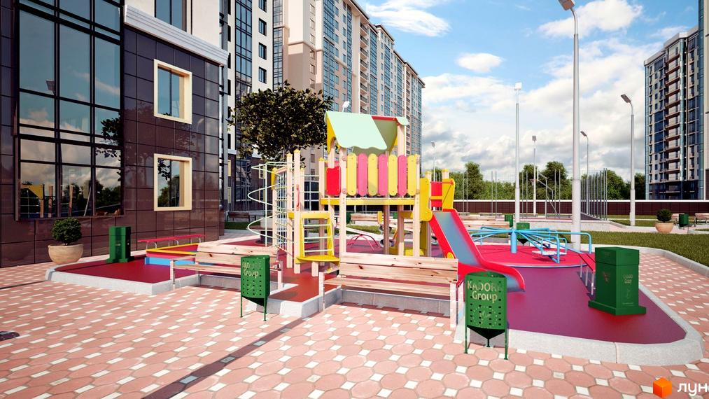 Житловий комплекс Сорок перлина. Високі будинки з скляними фасадами та дитячий майданчик з гіркою та гойдалками на території.