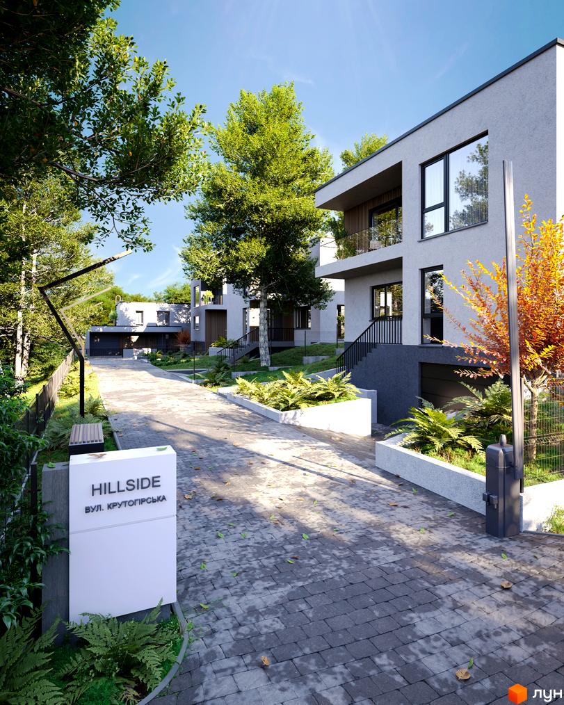 Котеджне містечко Hillside: світлі будинки з великими вікнами та балконами. Прибудинкова територія облаштована бруківкою та зеленими насадженнями.