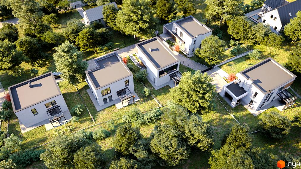 Вигляд зверху на котеджі в Котеджному містечку Hillside. Будинки з плоскими дахами та великими вікнами, навколо зелені дерева.