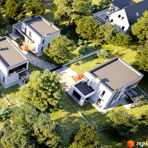 Вигляд зверху на Котеджне містечко Hillside з будинками з пласкими дахами та великою прибудинковою територією з деревами.