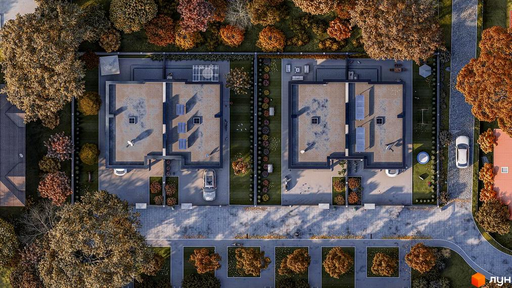 Вид зверху на будинки КМ CONTINENT HOME з плоскими дахами, сонячними панелями та доглянутою прибудинковою територією з деревами та газонами.