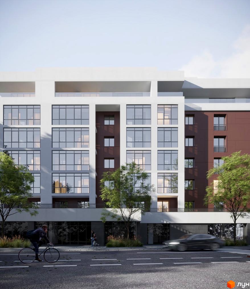 Багатоповерховий будинок з великими вікнами та терасами. На передньому плані дорога з автомобілем та людиною на велосипеді, зелені дерева.