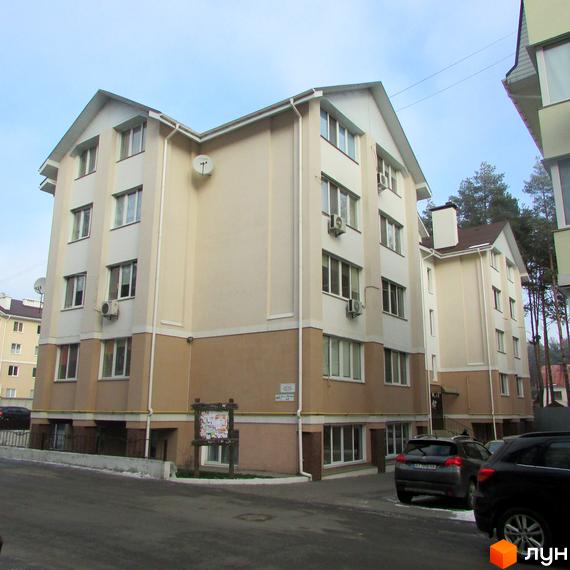 Зображення будинку Житлового комплексу Авангард на „Лісовій“. Багатоповерхова будівля з двома кольорами фасаду та великими вікнами.