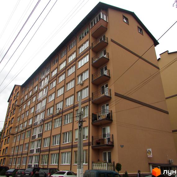 Багатоповерховий будинок Житловий комплекс Полтавський двір з балконами. На прибудинковій території припарковані автомобілі.