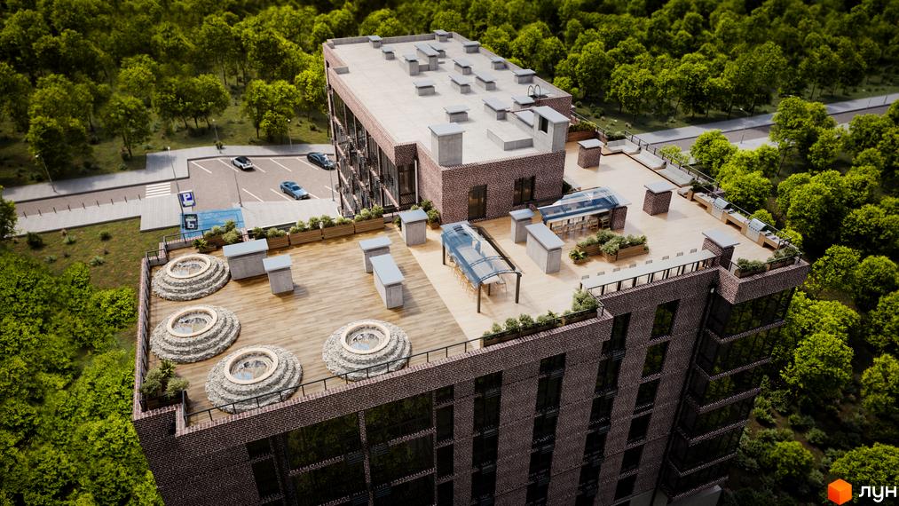Вид зверху на будівлю Клубний будинок Protasiv Hill з терасою на даху та зоною відпочинку, навколо зелені дерева.