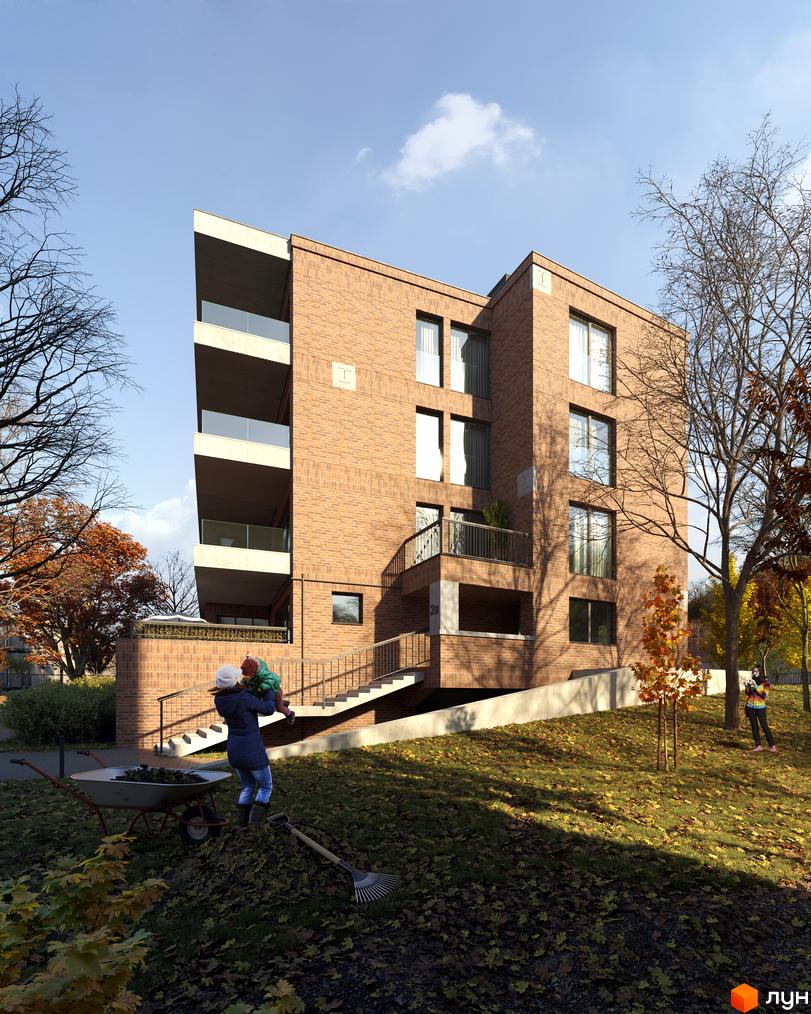 Зображення чотириповерхового будинку з червоної цегли з балконами. Навколо дерева з жовтим листям та доглянутий газон біля Новобудови AUROOM IRON.