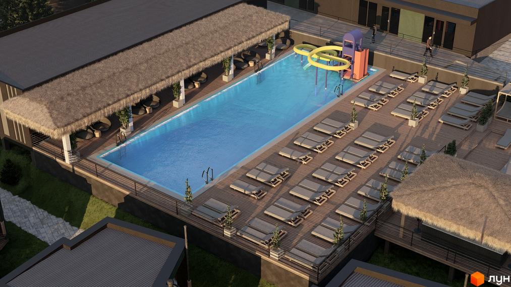 Котеджне містечко Малахіт: будівлі з темними дахами та терасами під солом'яними навісами. На території великий басейн з водною гіркою та шезлонгами.