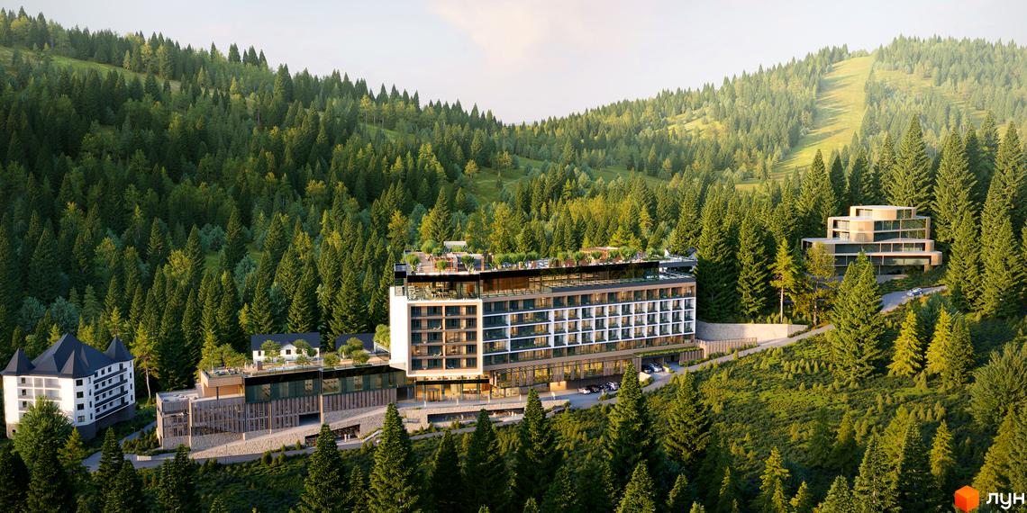 Фасад GRAND SPA RESORT AND CONFERENCE з білими та темними елементами, оточений густим хвойним лісом. Навколо комплексу видно гірські схили та дороги.