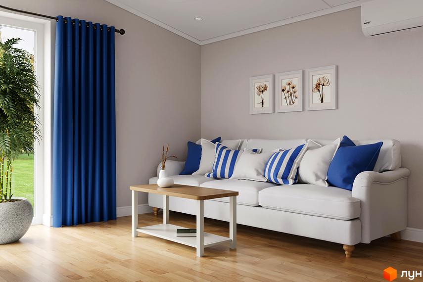 Інтер'єр вітальні в житловому комплексі VERHGORY з панорамним вікном та видом на зелену прибудинкову територію.