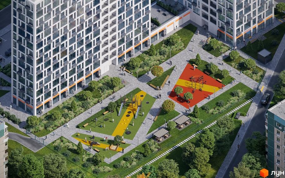Зображення Житлового комплексу Вертикаль з висоти пташиного польоту. На фото видно багатоповерховий будинок та дитячі майданчики.