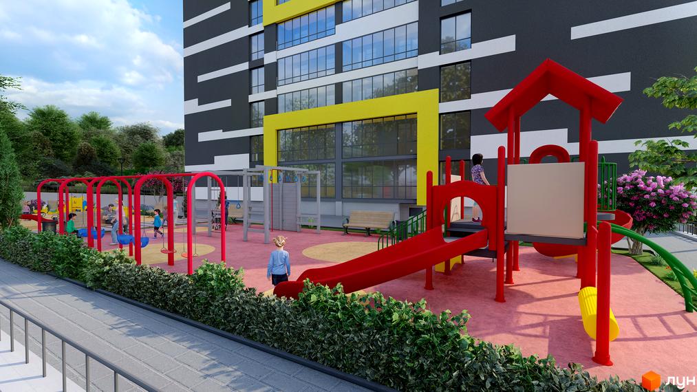 Сучасний житловий комплекс на Слівенській з яскравим дитячим майданчиком. Фасад будівлі оздоблений темними та світлими панелями з горизонтальними вставками.