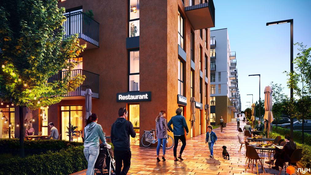 Житловий комплекс Садова Алея: фасади будівель та затишна вулиця з ресторанами та місцями для відпочинку.