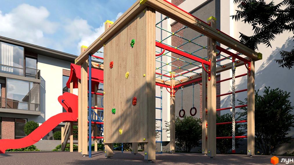 Дитячий майданчик у дворі ЖК Marseille. Ігровий комплекс з гіркою, стіною для скелелазіння та підвісними кільцями для розваг дітей.