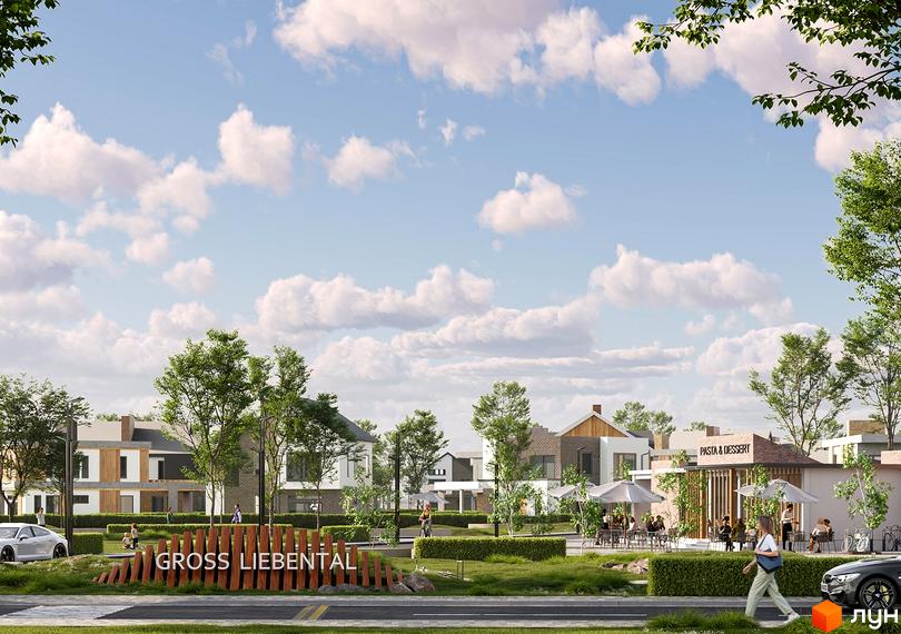Малоповерхові будинки Котеджного містечка Gross Liebental з різними фасадами, оточені зеленими насадженнями та зоною відпочинку з кафе.