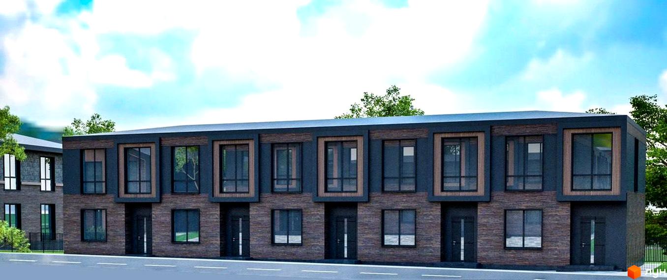 Котеджне містечко Garden Village Sofia. Фасад будинку з темної цегли та темних панелей, великі вікна, вхідні двері.