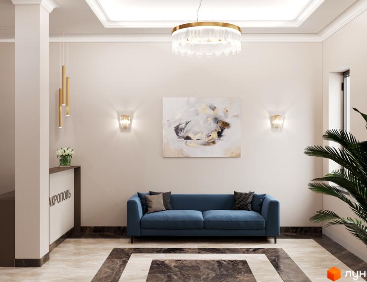 Інтер'єр холу в Житловому комплексі Акрополь: диван, картина, освітлення. Вигляд внутрішнього оздоблення та меблів у зоні відпочинку.