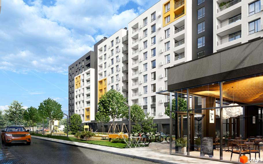 Зовнішній вигляд житлового комплексу Сімейний COMFORT 2 з фасадами білого, сірого та жовтого кольорів. Прибудинкова територія з деревами, дитячим майданчиком та кафе.