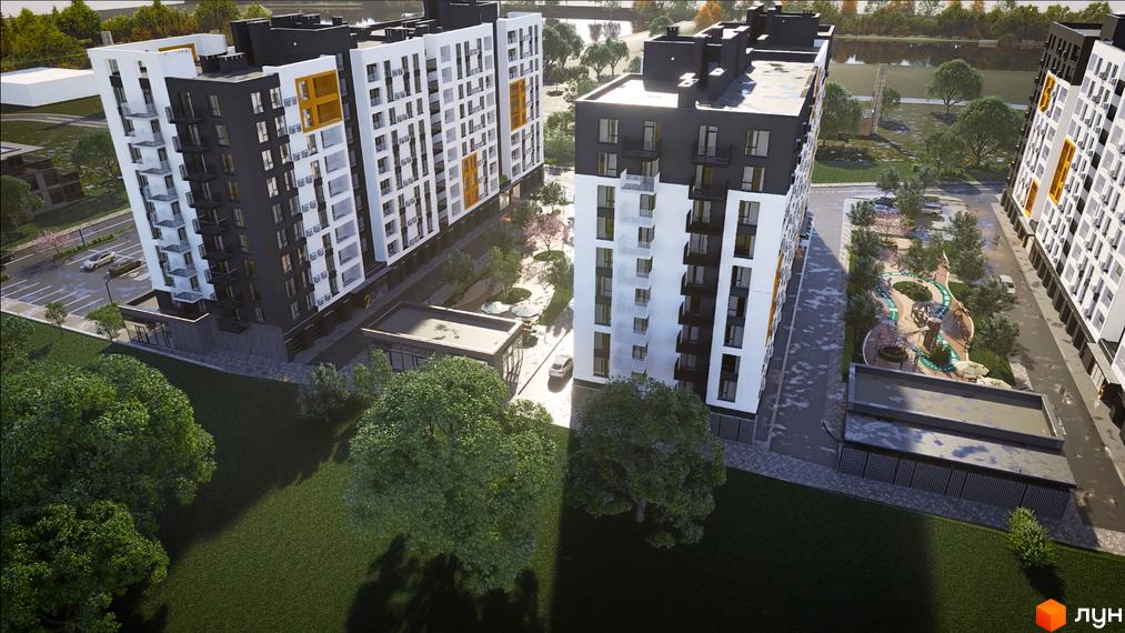 Комплекс Сімейний COMFORT 2 з біло-чорними фасадами та жовтими акцентами, має внутрішній двір з дитячим майданчиком та зеленими насадженнями.